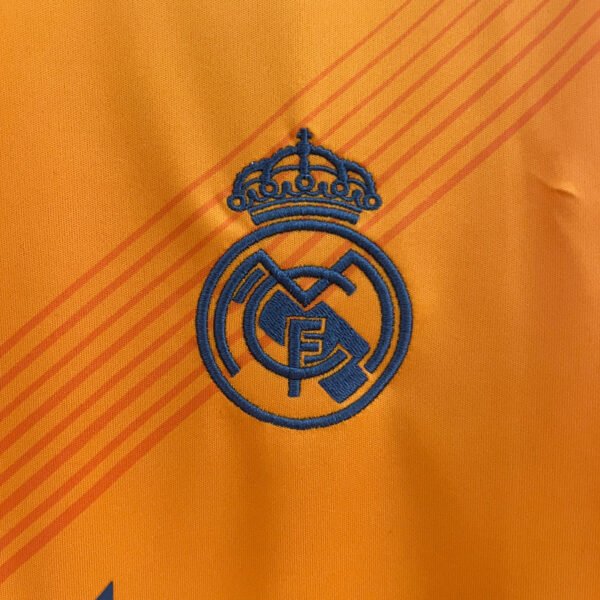 24-25 Real Madrid away orange - Image 6